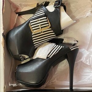 C Label Black Heels with White Stripes and Gold Buckle